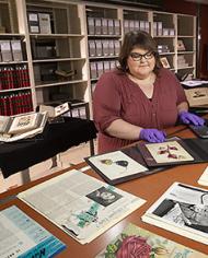 Jamie Flood updating Wikipedia entries about the special collections of Dr. Hazel Stiebling and watercolorist, Deborah Passmore .