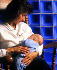 A mother breast feeding her baby.